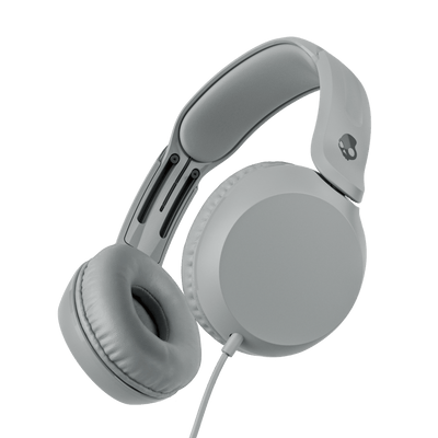 Grey over-ear wired headphones shown at an angle against a solid black background. | Cement