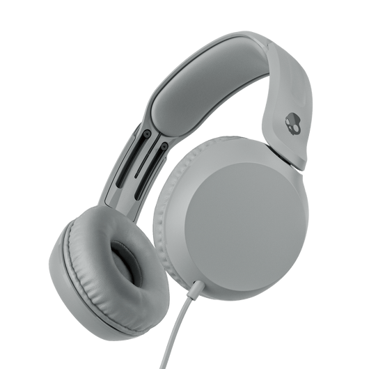 Grey over-ear wired headphones shown at an angle against a solid black background. | Cement