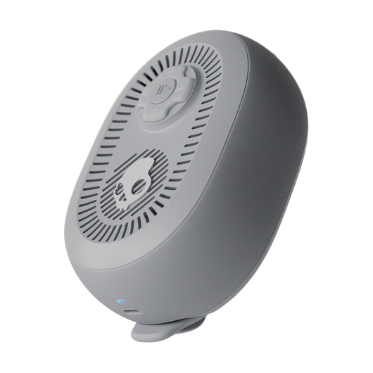 Gray electronic device with a circular design on a white background | Cement